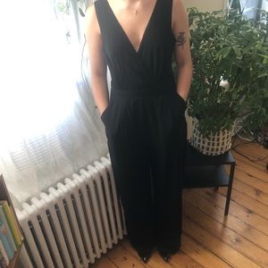 NWT black jumpsuit with lace back and pockets 🖤
